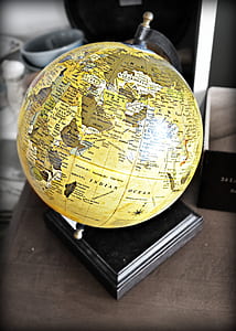 yellow and black desk globe on table thumbnail