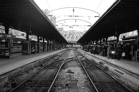 grayscale photography of train station thumbnail