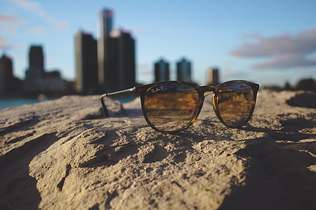 Ray-Ban sunglasses on rock thumbnail