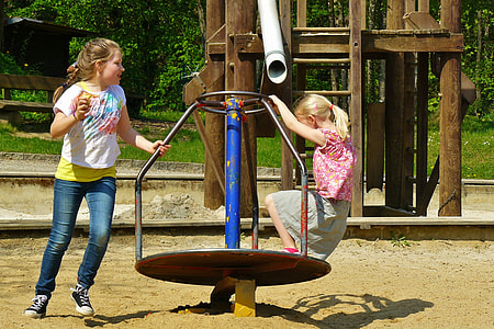 toddler's white shirt and blue pants playing in open playground thumbnail