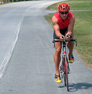 man riding road bike during daytime thumbnail