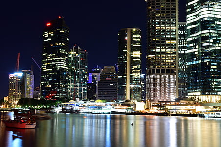 red and white boat on body of water during nighttime thumbnail