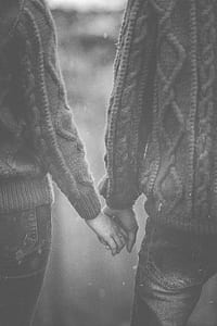 man and woman holding their hands thumbnail