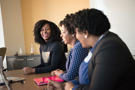 Smiling Woman Leaning on Table thumbnail