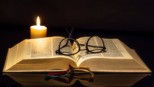 eyeglasses with black frame on white book thumbnail