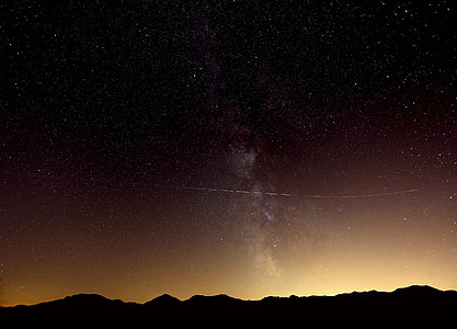 silhouette of mountain during nighttime thumbnail