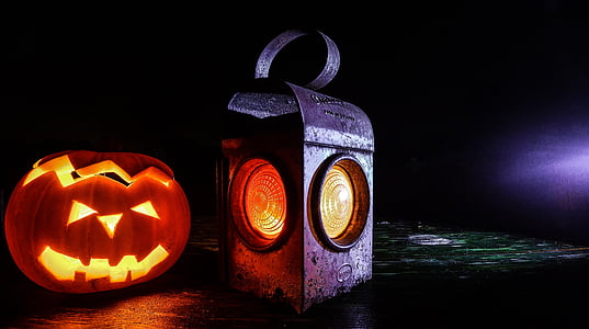 black metal lantern beside Jack-O-Lantern thumbnail