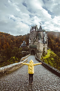 person standing in front gray palace thumbnail