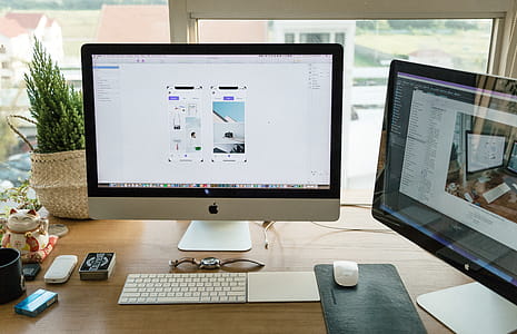 Apple Imac on Brown Wooden Desk thumbnail
