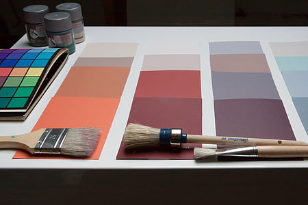 brown paint brush on white and orange paper thumbnail