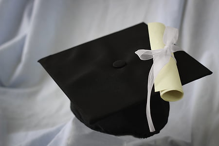 black acamedic hat on white textile thumbnail