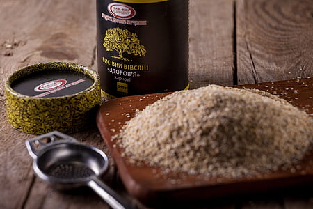 gray powder on top of brown chopping board thumbnail
