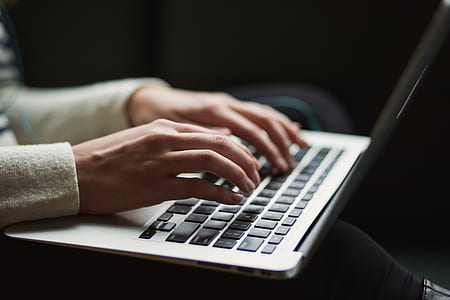 person using white laptop computer thumbnail
