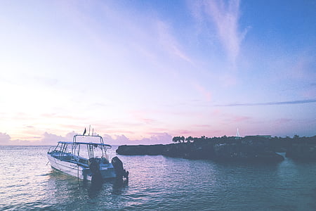 white boat near island thumbnail