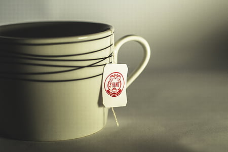 white ceramic mug with saint tag thumbnail