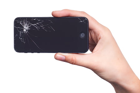 person holding black broken iPhone 5 thumbnail