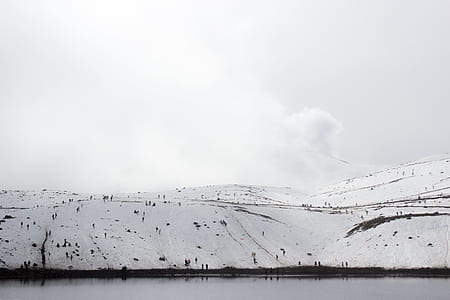 black mountain covered by white snow during daytime thumbnail
