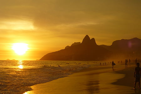 lot of people on seashore during sunset thumbnail