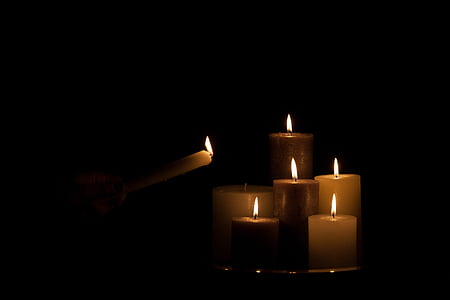 lighted brown and white candles thumbnail