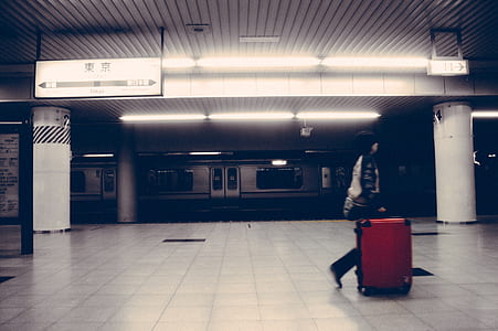 woman wearing white and black shirt carrying cart thumbnail