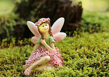 girl fairy ceramic figurine on land thumbnail