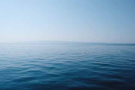body of water under blue and white sky thumbnail
