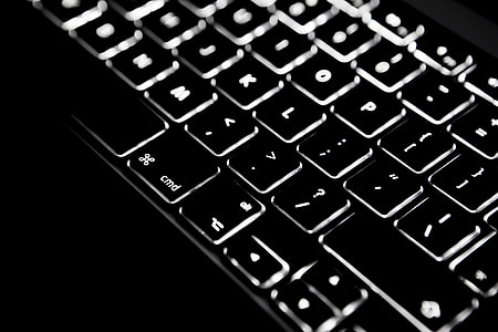 Close-up shot of backlit keyboard on an Apple Macbook Pro retina laptop model thumbnail