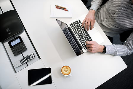 flat lay photography of MacBook Pro, teacup, and black iPad thumbnail