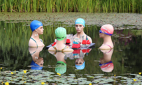 four person in body of water at daytime thumbnail