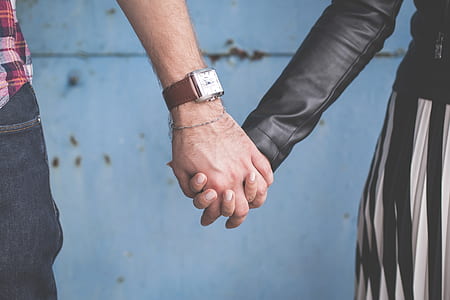 man and woman holding hands thumbnail