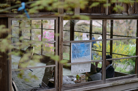 gray wooden window house during daytime thumbnail