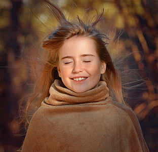 selective focus photography of girl smiling close eyes thumbnail