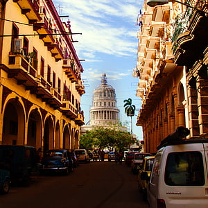 white concrete castle between buildings photography thumbnail