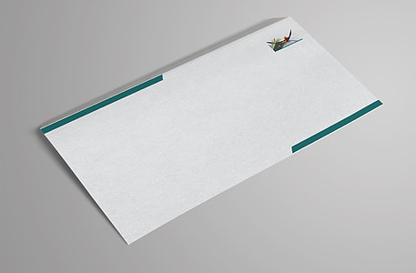 white and green envelope on white surface thumbnail