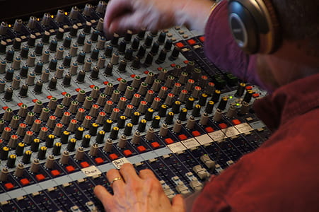 man operating audio mixer thumbnail