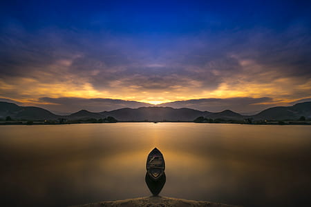 body of water near mountain thumbnail