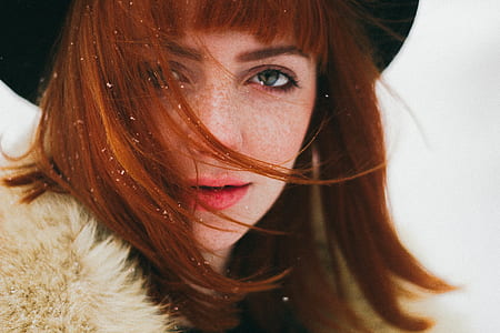 woman wearing black hat and fur coat during winter season thumbnail