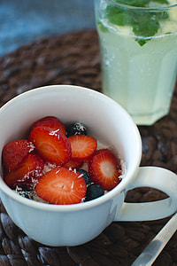 Cup of oatmeal with berries and coconut thumbnail