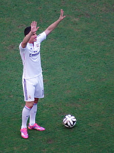 man standing in front of soccer ball thumbnail