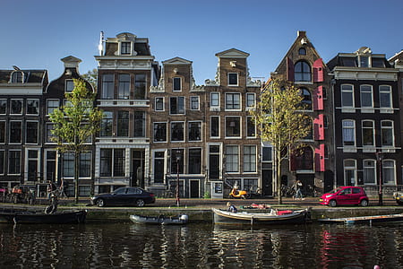 docked boats on water near buildings thumbnail