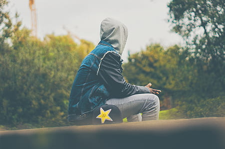 person sitting on a hedge thumbnail