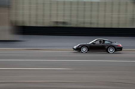 timelapse photography of black coupe while moving thumbnail