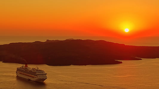 aerial photography of white ship near island at golden hour thumbnail