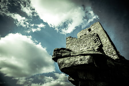 castle on top of mountain during daytime thumbnail