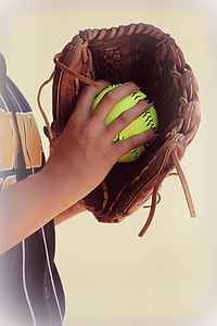person holding baseball and baseball mitt thumbnail