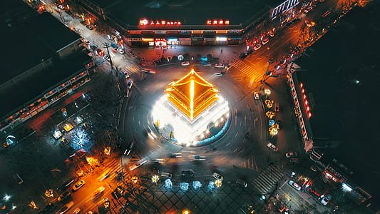 birds eye view of pagoda surrounded with cars thumbnail