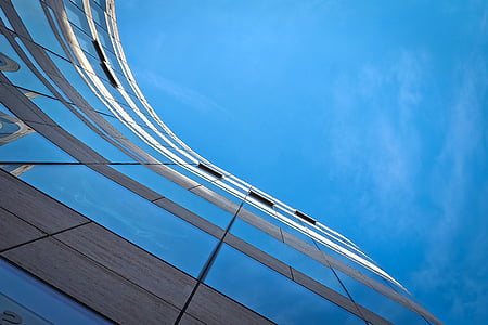 low-angle photography of curtain building under blue sky during daytime thumbnail