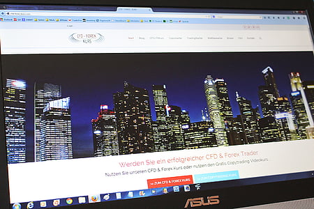 turned-on black Asus monitor displaying high-rise buildings screengrab thumbnail
