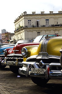 vehicles park in front of building thumbnail