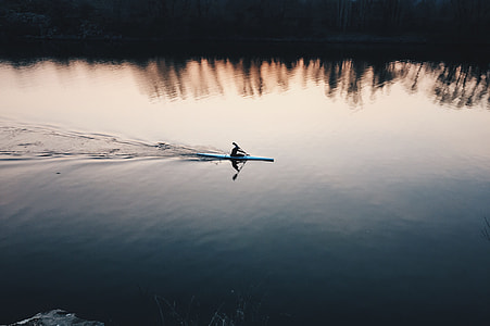 person on boat travelling on water thumbnail